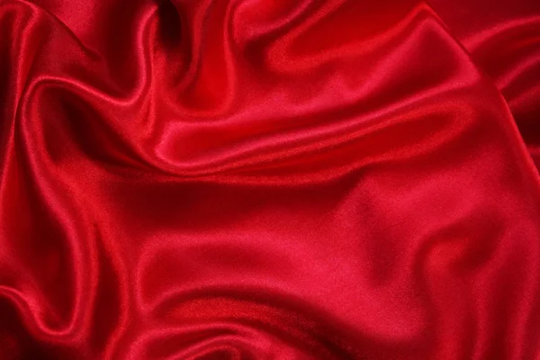 Hladké elegantní červené hedvábí může použít jako pozadí — Stock fotografie