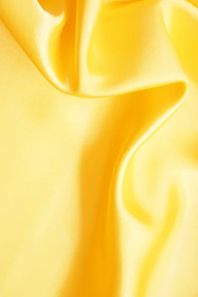 Gładkie elegancki jedwab złoty jako tło — Zdjęcie stockowe