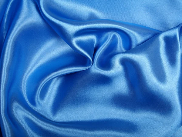A sima, elegáns kék selyem háttérként használható — Stock Fotó