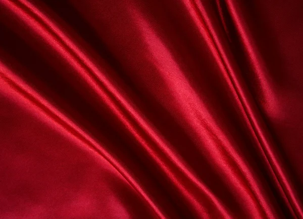 Gładkie elegancki czerwony jedwab jako tło — Zdjęcie stockowe