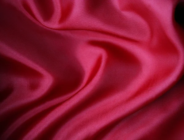 Гладкий червоний шовк як фон — стокове фото