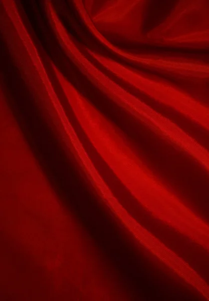 Hladké červeného hedvábí jako pozadí — Stock fotografie