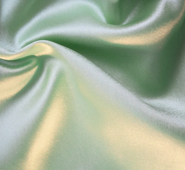 背景として滑らかなエレガントな緑色の絹 — ストック写真