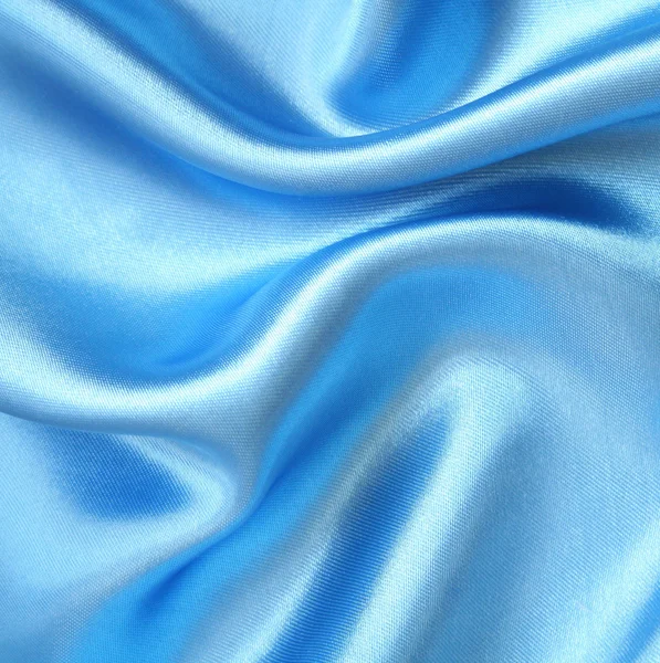Гладкий елегантний синій шовк як фон — стокове фото