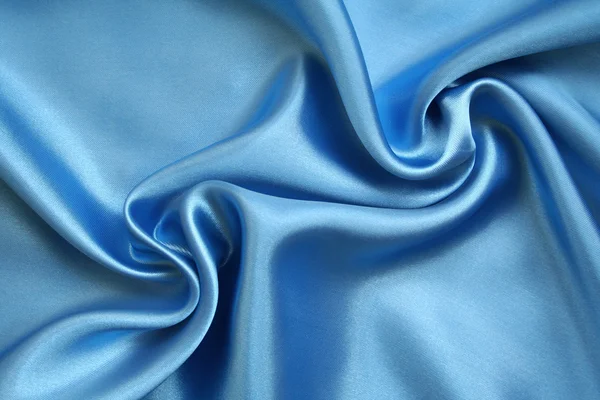 Sileä tyylikäs sininen silkki taustana — kuvapankkivalokuva