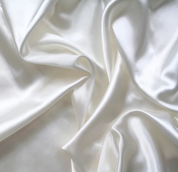 Hladké elegantní bílé hedvábí jako pozadí — Stock fotografie