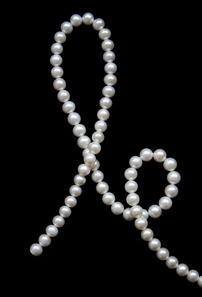 White pearls on the black velvet — Stock Photo, Image