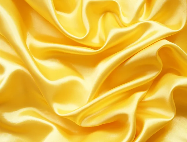 Smooth elegant golden silk can use as background — Stock Photo, Image