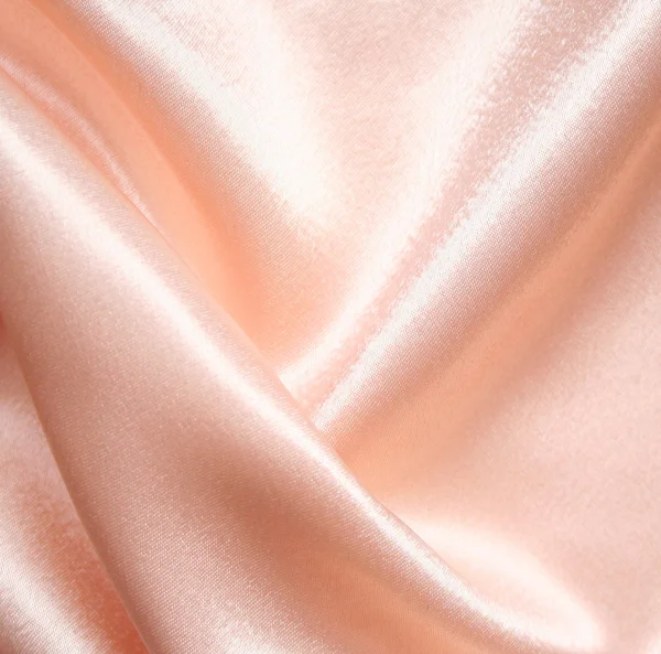 Soepele elegante roze satijn als achtergrond — Stockfoto