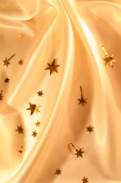 Férias de ano novo seda dourada como fundo — Fotografia de Stock