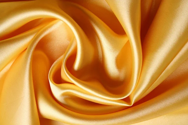 Liso elegante cetim dourado como fundo — Fotografia de Stock