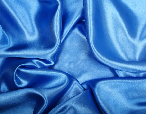 Hladké elegantní modré hedvábí může použít jako pozadí — Stock fotografie