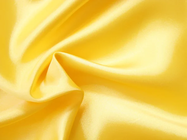 Slät elegant gyllene silke kan använda som bakgrund — Stockfoto