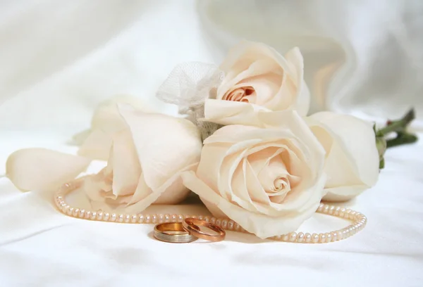 Wedding rings and roses Stock Image