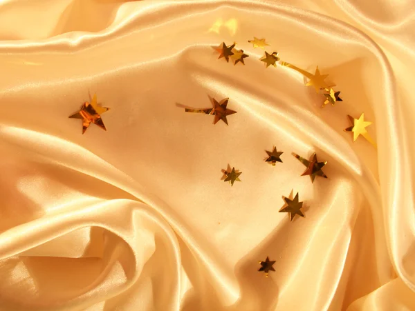 New year holiday golden satin as background — Stock Photo, Image