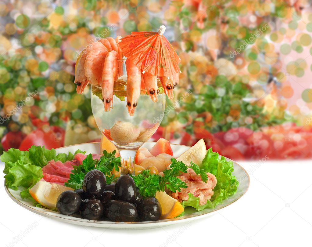 Appetizer of shrimp, fish, meats, olives and fresh vegetables