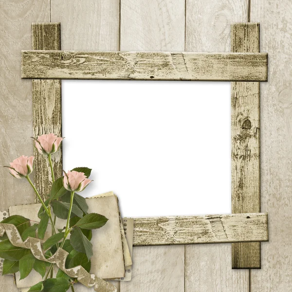 Old wooden background with frame and bunch of flower — Stock Photo, Image