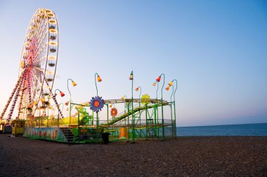 Ferris Wheel at the ocean clipart