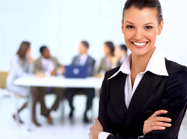 Portrait of successful businesswoman and business team at office meeting — Stockfoto