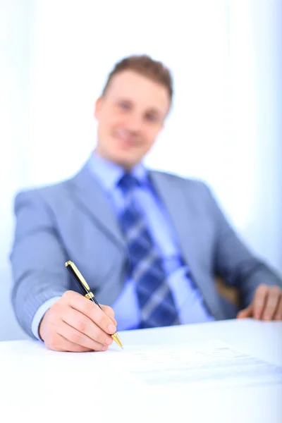 Full length of a handsome business man with hands folded against white back — Stock Photo, Image