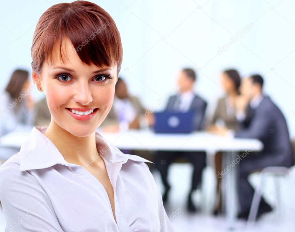Portrait of a cute young business lady looking happy at office
