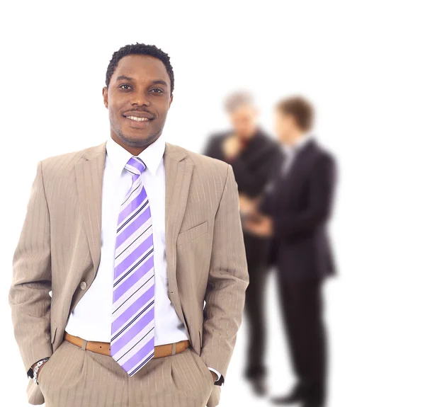 Affärsman på kontoret med en grupp bakom honom — Stockfoto
