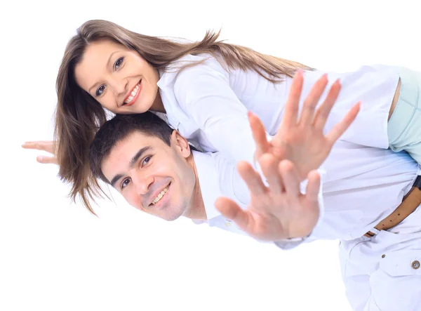 Smiling young man carrying his beautiful girlfriend on his back with their — Stock Photo, Image