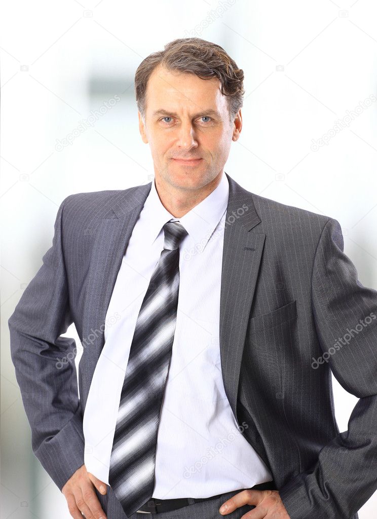 Closeup portrait of a happy mature business man smiling - Copyspace