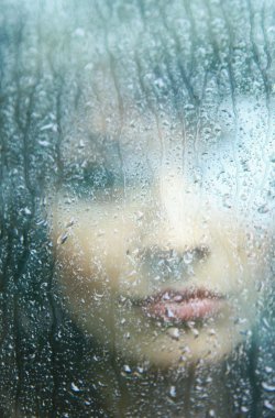 Sad young woman and a rain drops clipart