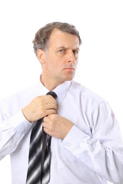 stock image Portrait of businessman tying tie