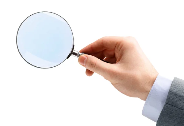 Magnifying glass in hand isolated over white background — Stock Photo, Image