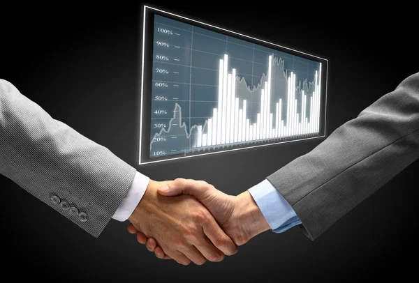 Handshake - Hand holding on black background — Stock Photo, Image