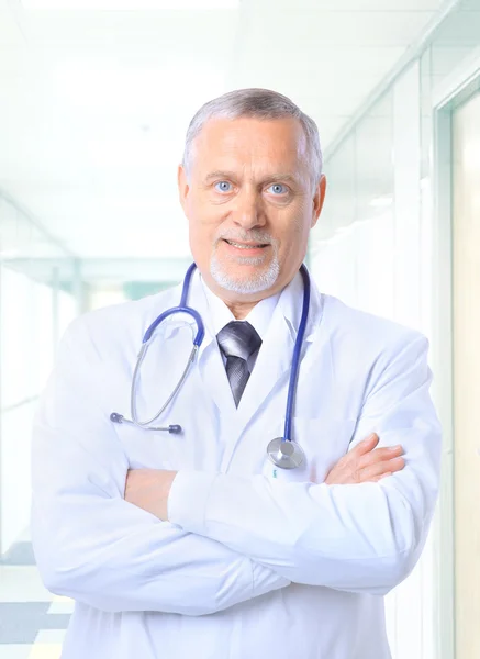 Closeup portrait of a happy senior doctor with stethoscope Stock Picture
