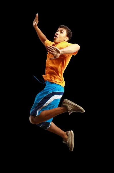 Genç Afro-Amerikan çocuk ile genişletilmiş silah atlama — Stok fotoğraf