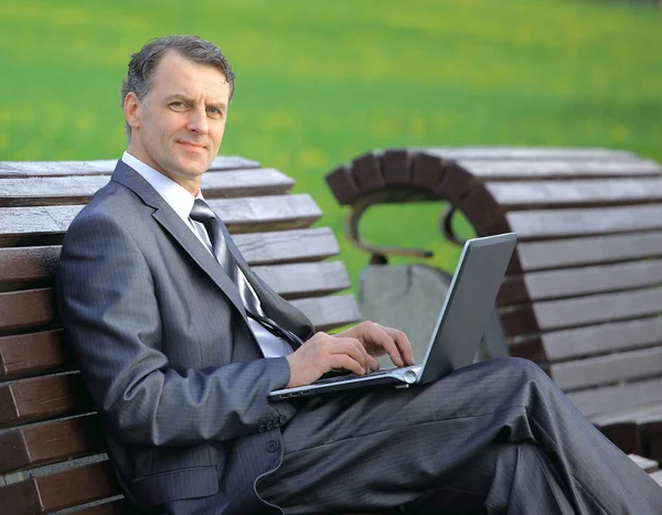 Young guy is working outdoors — Stock Photo, Image