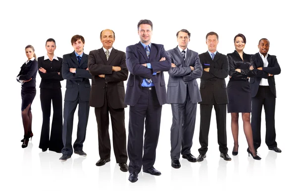 El equipo de negocios formado por jóvenes empresarios y empresarias de pie sobre un — Foto de Stock