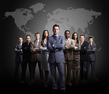 Businessmen standing in front of an earth map clipart