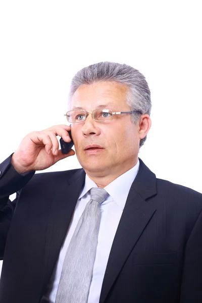 Mature homme exécutif donnant des explications et parler au téléphone mobile — Photo
