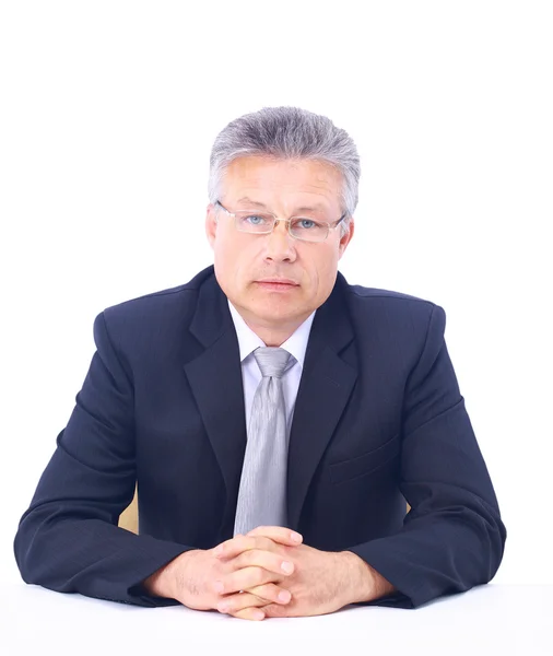 A portrait of senior businessman sitting during an interview isolated again — Stock Photo, Image