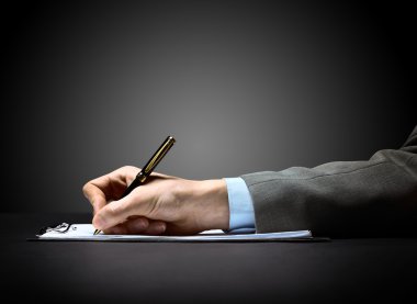 Businessman's hand with pen clipart