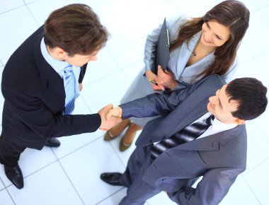 Full length image of two successful business men shaking hands with eachoth clipart