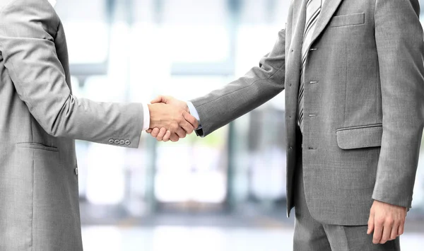 Handshake isolated on blue background — Stock Photo, Image