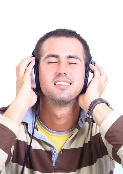 Człowiek w niebieską koszulę z słuchawki słuchać muzyki - na białym tle — Zdjęcie stockowe