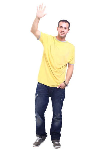 Full length portrait of a stylish young man standing with hands in pockets — Stock Photo, Image