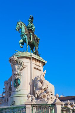 Statue of King Joao I at Figueiroa Square, and St. Jorge castle clipart