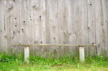 Old Bench Against Wooden Wall clipart