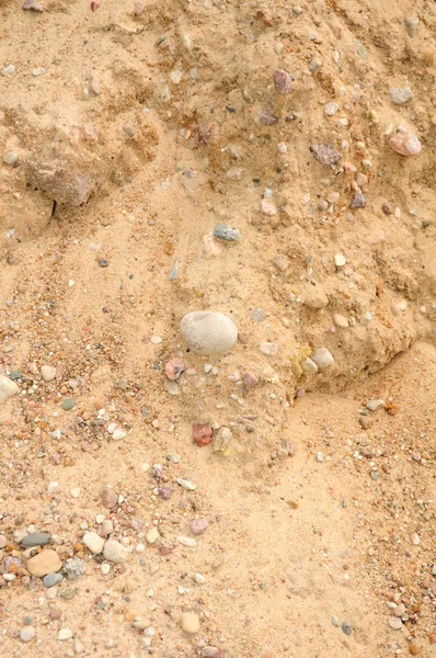 Hromádka písku s kameny — Stock fotografie