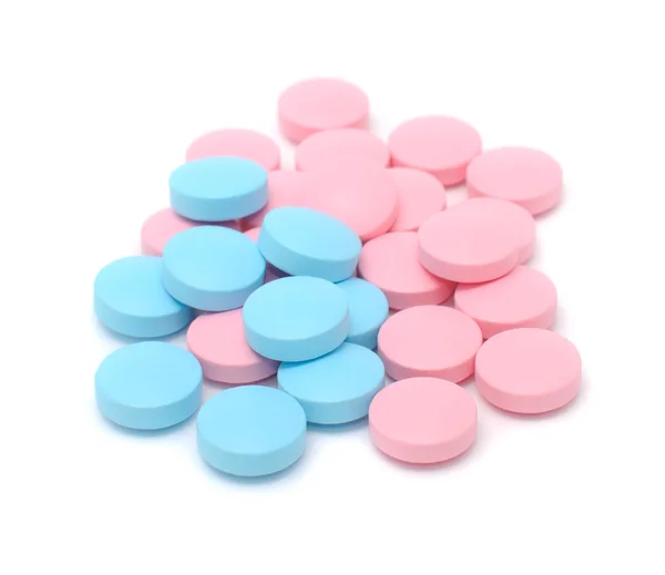 Niebieskie i różowe tabletki — Zdjęcie stockowe
