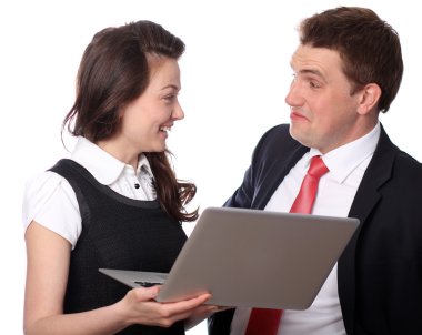 Casual couple looking at laptop