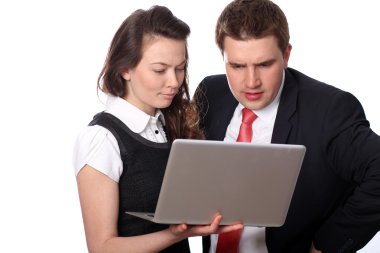 Casual couple looking at laptop